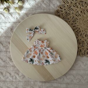 Kötényruha masnival